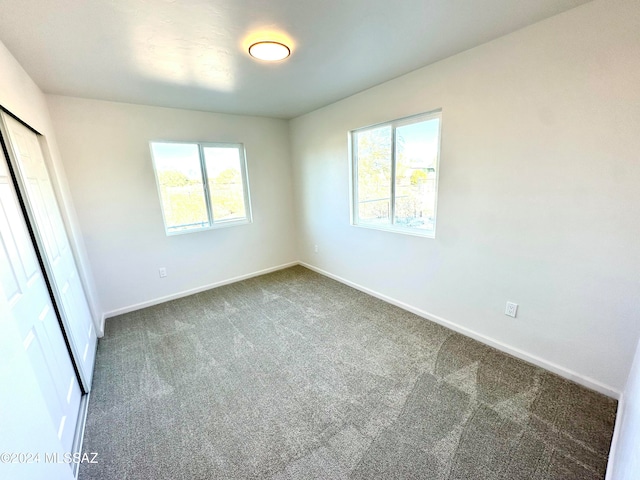 unfurnished bedroom featuring carpet