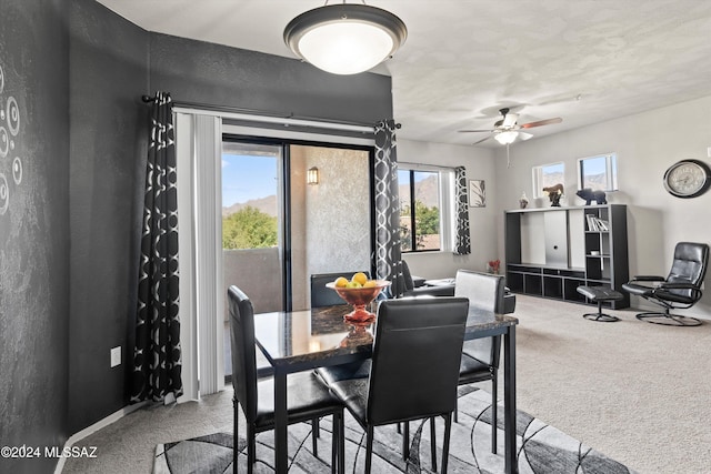 dining room with carpet flooring and ceiling fan