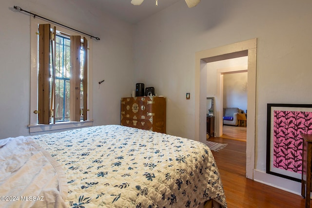 bedroom featuring ceiling fan and hardwood / wood-style flooring