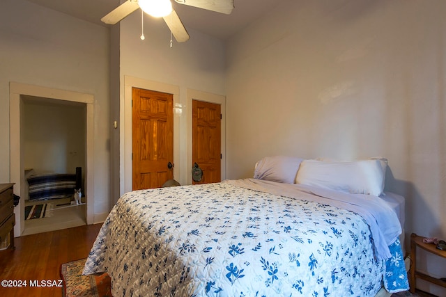 bedroom featuring dark hardwood / wood-style flooring and ceiling fan