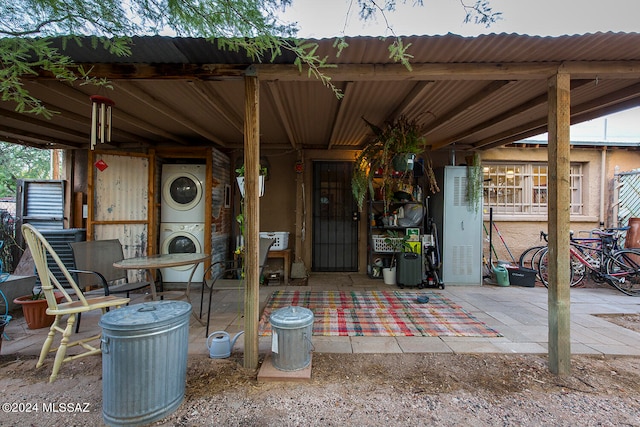 view of patio featuring stacked washer / dryer