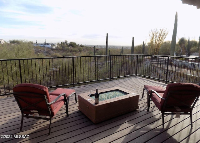 deck featuring an outdoor fire pit