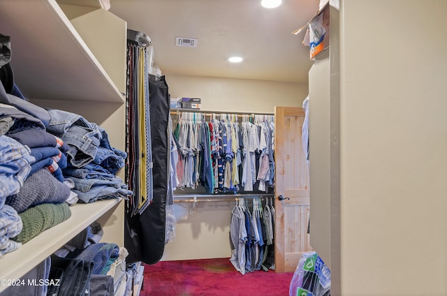 spacious closet featuring carpet floors