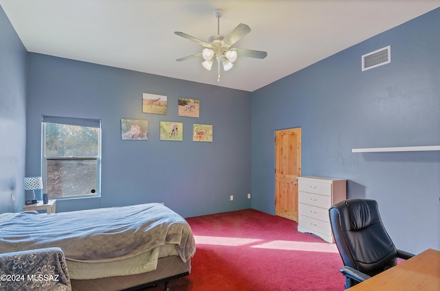 carpeted bedroom with visible vents and a ceiling fan