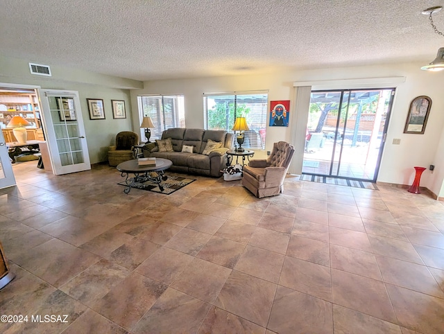 living room with a textured ceiling