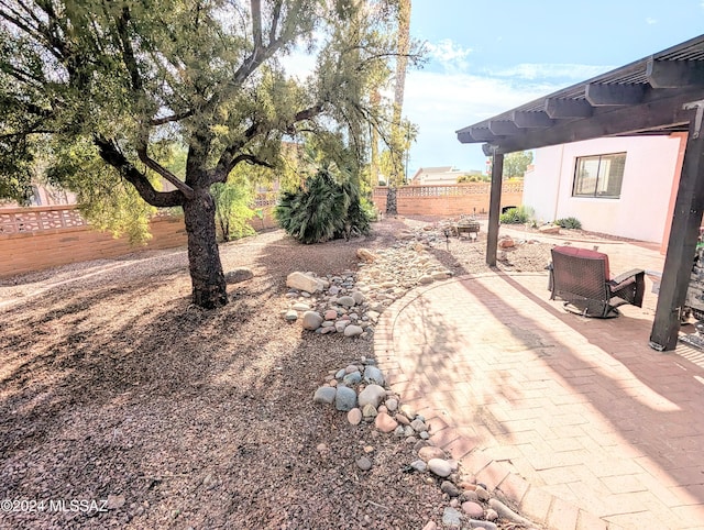 view of yard featuring a patio and a pergola