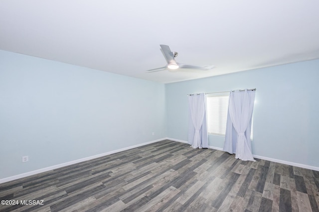 spare room featuring dark hardwood / wood-style floors and ceiling fan