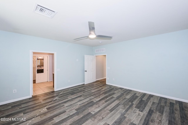 unfurnished bedroom featuring dark hardwood / wood-style floors and ceiling fan