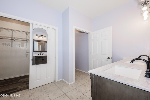 bathroom featuring tile patterned flooring and vanity