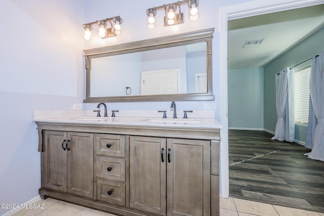 bathroom featuring hardwood / wood-style floors and vanity