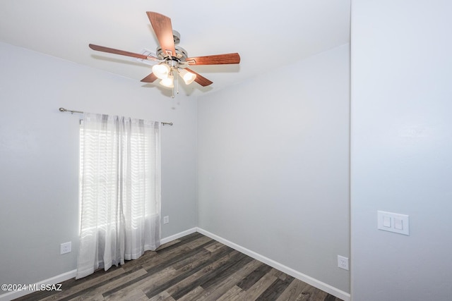 unfurnished room with ceiling fan and dark hardwood / wood-style flooring