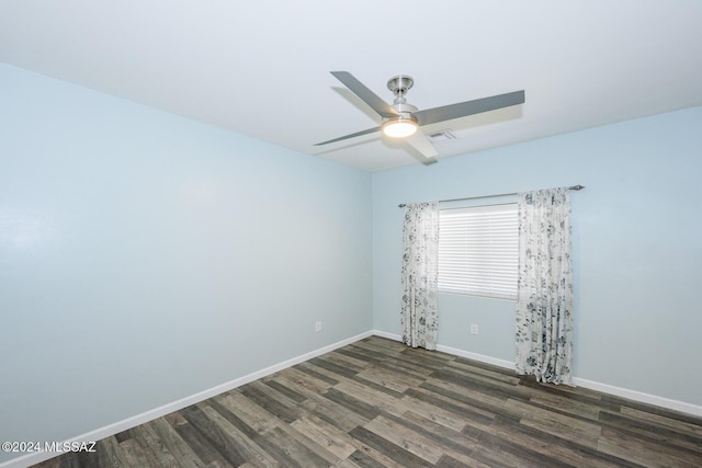 unfurnished room with dark wood-type flooring