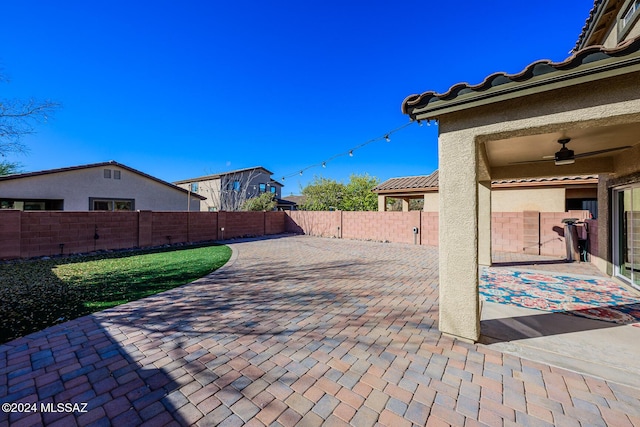 view of patio featuring ceiling fan