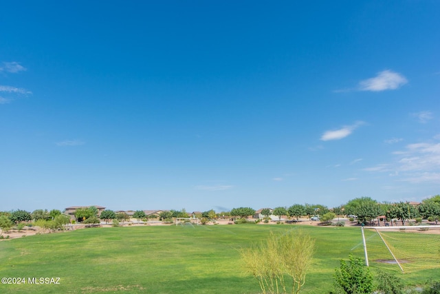 view of home's community featuring a lawn