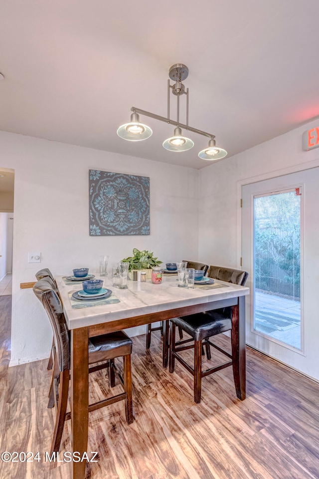 dining area with wood-type flooring