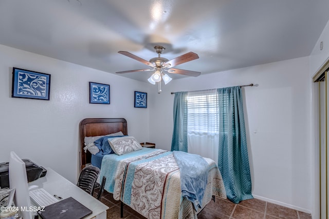 bedroom with tile patterned floors and ceiling fan