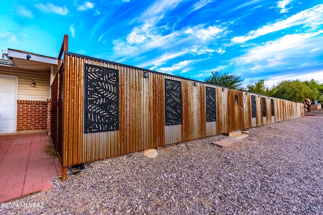 view of gate featuring a garage