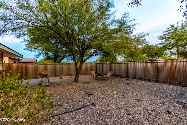 view of yard featuring a fire pit