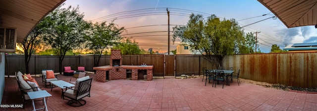 patio terrace at dusk featuring a bar