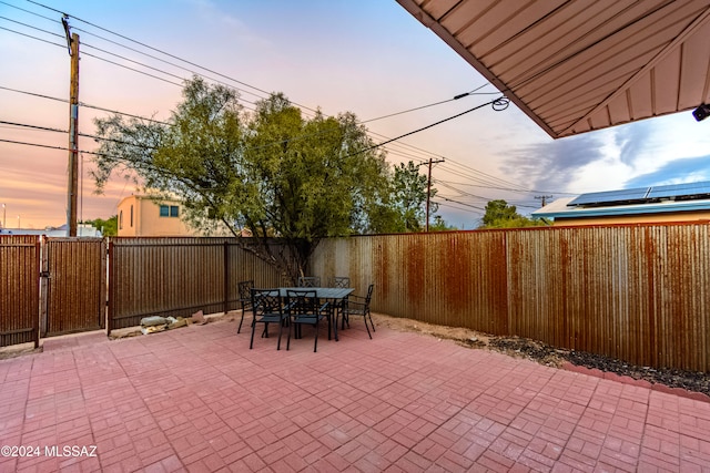 view of patio terrace at dusk