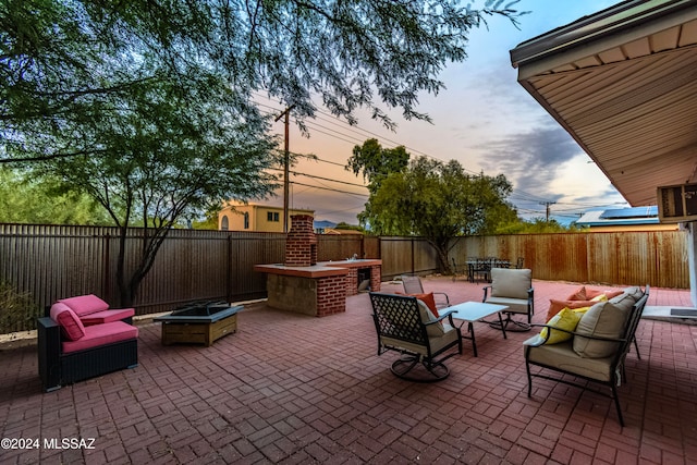 patio terrace at dusk with an outdoor hangout area