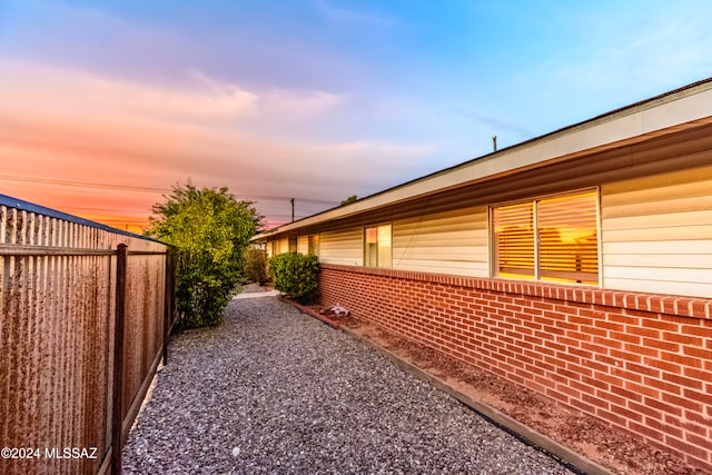 view of property exterior at dusk