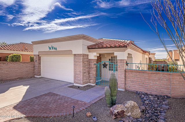 mediterranean / spanish-style home featuring a garage