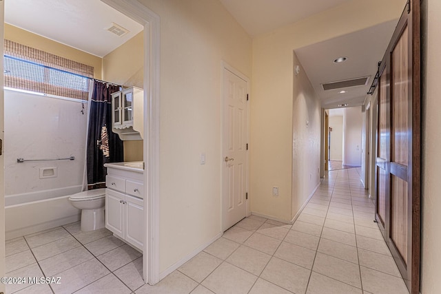 hallway featuring light tile patterned floors