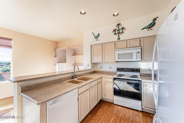 kitchen featuring light brown cabinetry, sink, white appliances, and light hardwood / wood-style flooring