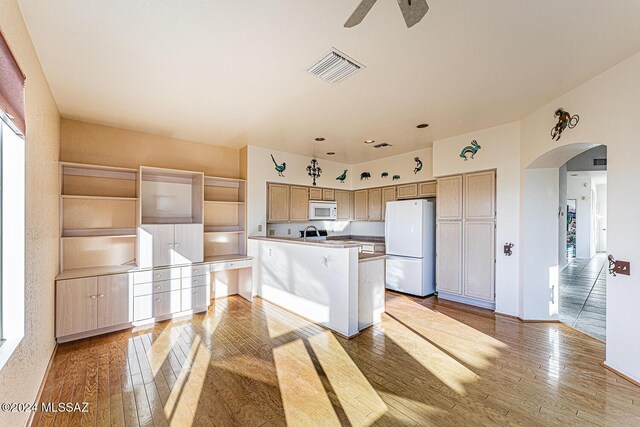 kitchen with ceiling fan, white appliances, and light hardwood / wood-style flooring