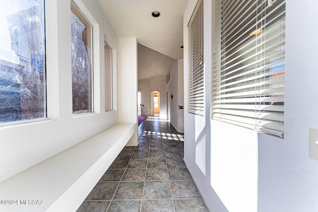 unfurnished room with vaulted ceiling, ceiling fan, and dark hardwood / wood-style flooring