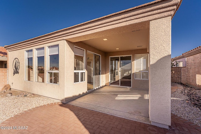 rear view of house featuring a patio area