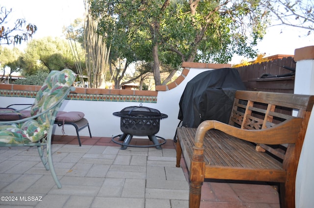 view of patio / terrace with a fire pit