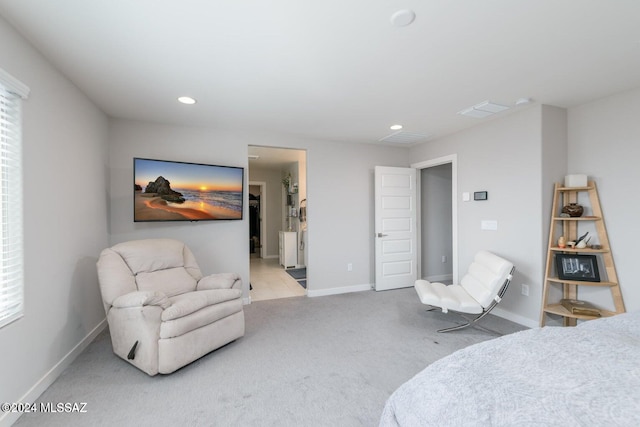 carpeted bedroom with multiple windows