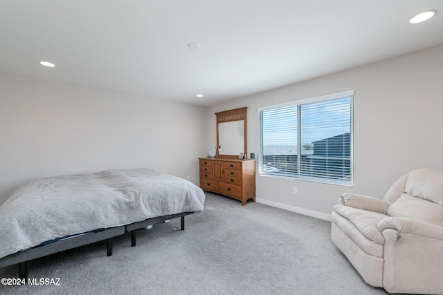 bedroom featuring light carpet