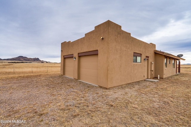 view of home's exterior featuring a mountain view