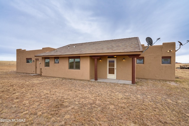 rear view of property with a patio area