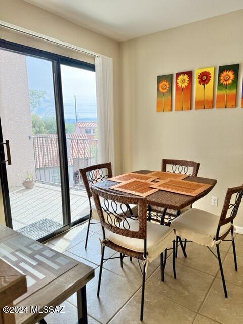 dining area with light tile patterned floors