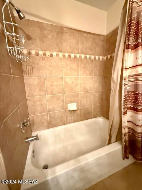 bathroom with shower / bathtub combination with curtain