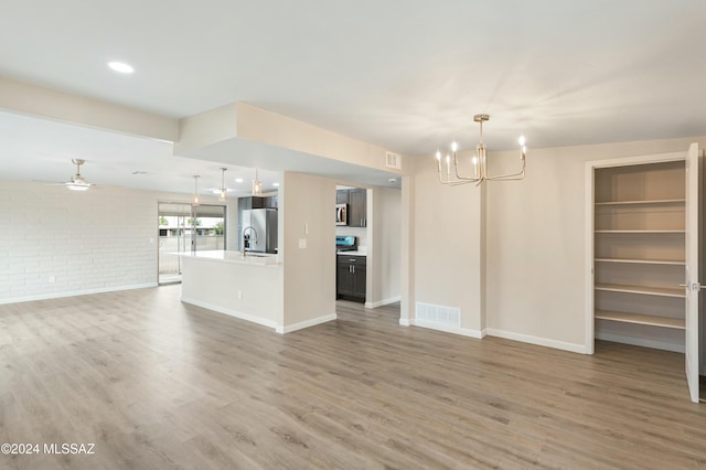 interior space featuring a chandelier, hardwood / wood-style flooring, and sink