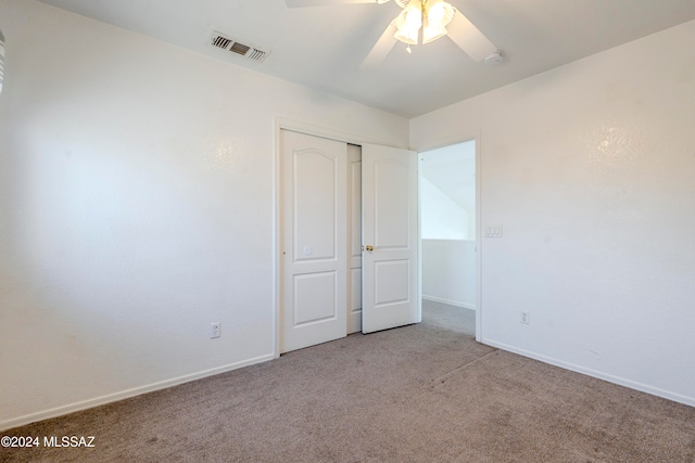 interior space with light carpet and ceiling fan