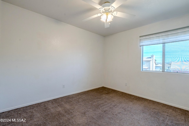 carpeted empty room with ceiling fan