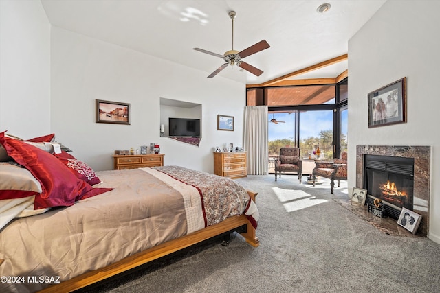 bedroom featuring ceiling fan, carpet floors, a high end fireplace, and vaulted ceiling