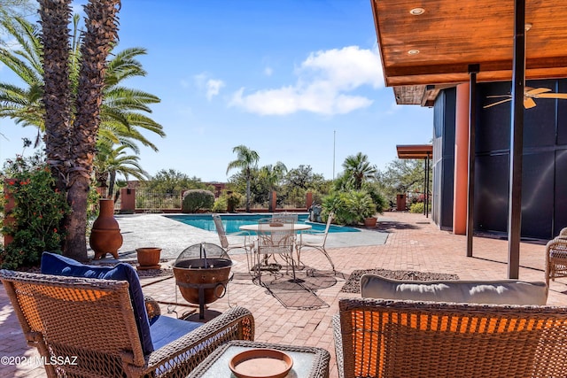 view of patio / terrace featuring an outdoor fire pit