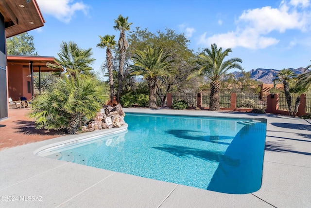 view of pool with a mountain view