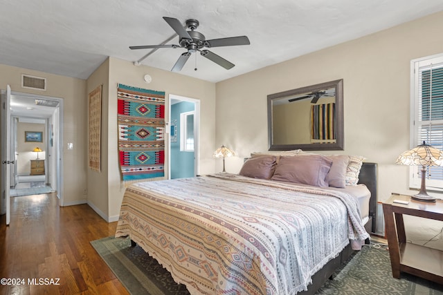 bedroom featuring ceiling fan and dark wood-type flooring