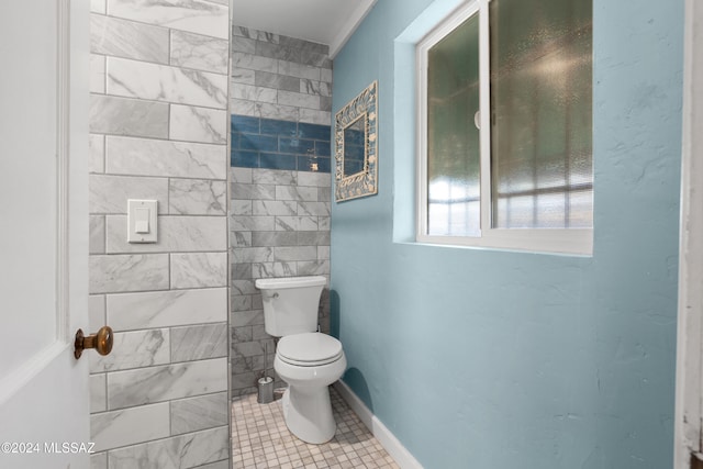 bathroom with tile patterned flooring and toilet