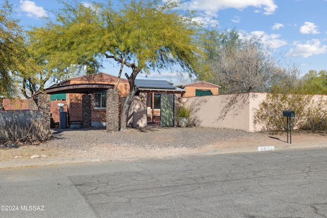 view of front of house with solar panels