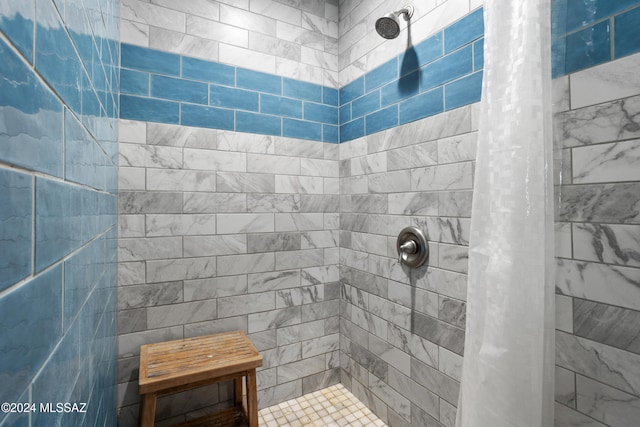 bathroom with a shower with shower curtain