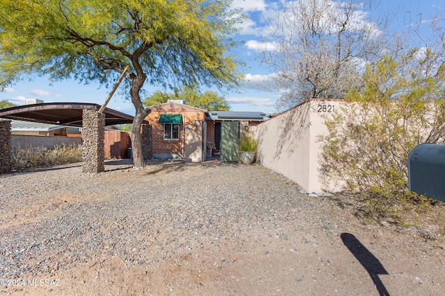 exterior space featuring a carport